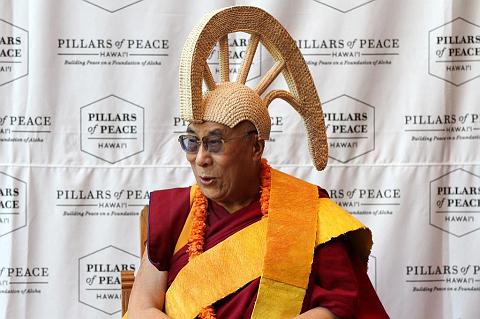 
Dalai Lama Wearing a custom-made mahi'ole a traditional Hawaiian helmet during his visit to Oahu on April 14, 2012
